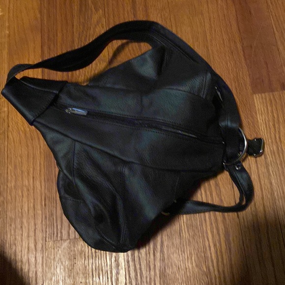 Never been used! Black leather multi usage bag. Can wear as a backpack or purse - Picture 2 of 3